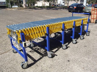 Powered extendable roller conveyor collapsed Powered extendable roller conveyor collapsed